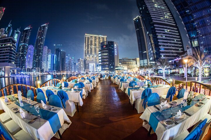 Savor an exquisite 5-star buffet amidst Dubai's dazzling skyline with stunning views and the gentle sounds of the water making for an unforgettable dining experience.